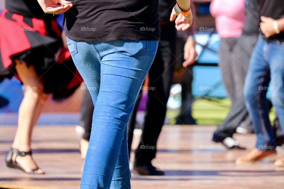 Waist down image dance competition and person in jeans walking