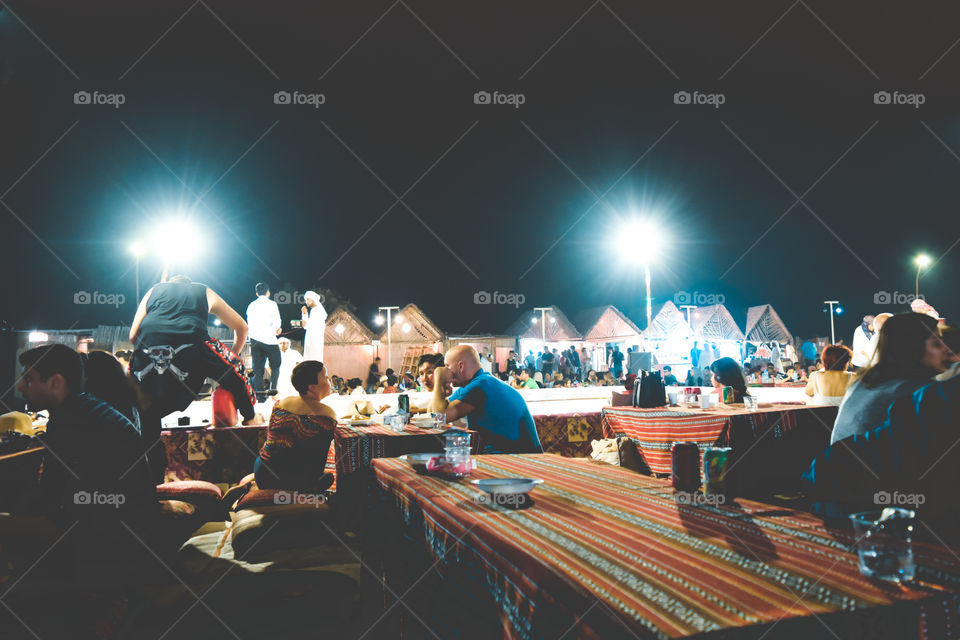Mumbai, India - January 2, 2019: Customers dining at a famous coastal cafes in late night party. It outdoor restaurant cafe or a traditional hippie bar at shore of tropical island in open air.