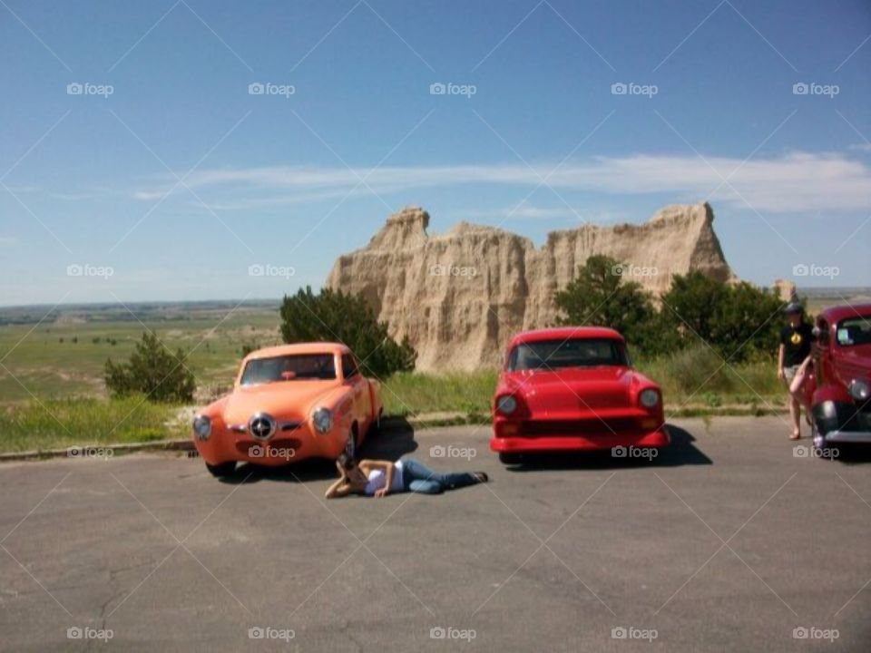 Posing with some cars in Badlands, ND 