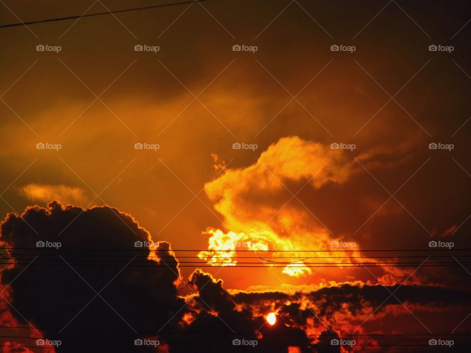 Amber sunset with pop-up thunderstorm luminary clouds 