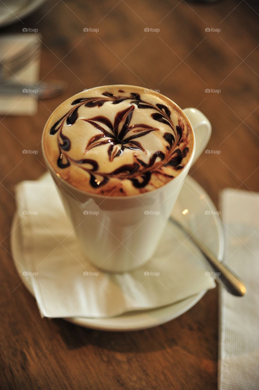 Coffee on saucer on table