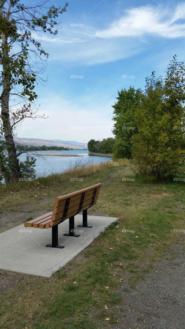 Resting bench overlooking the river view.