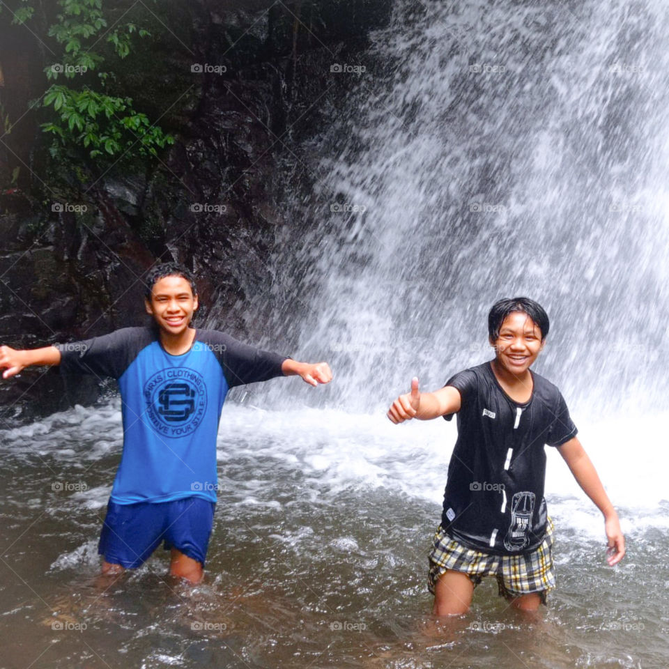 people on the waterfall