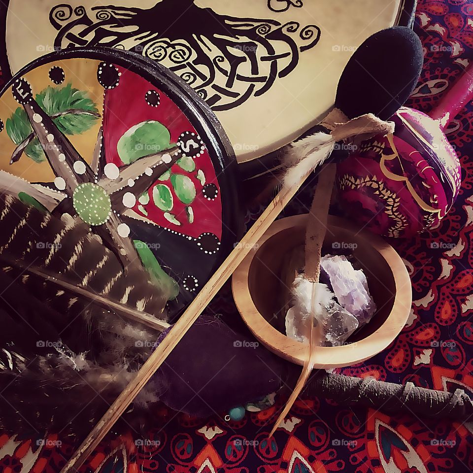 Curiousity of spiritual practice shamanic journeying path of drum, rattle and medicine wheel, smudge fan of turkey feathers and crystals balance energy of spirit.