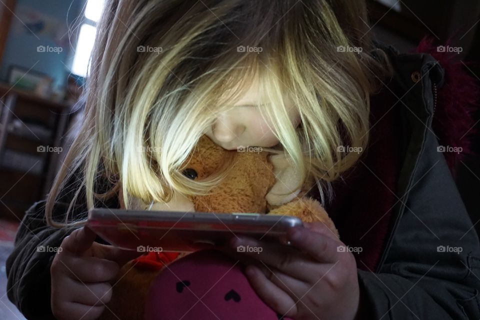 Girl watching on a smartphone