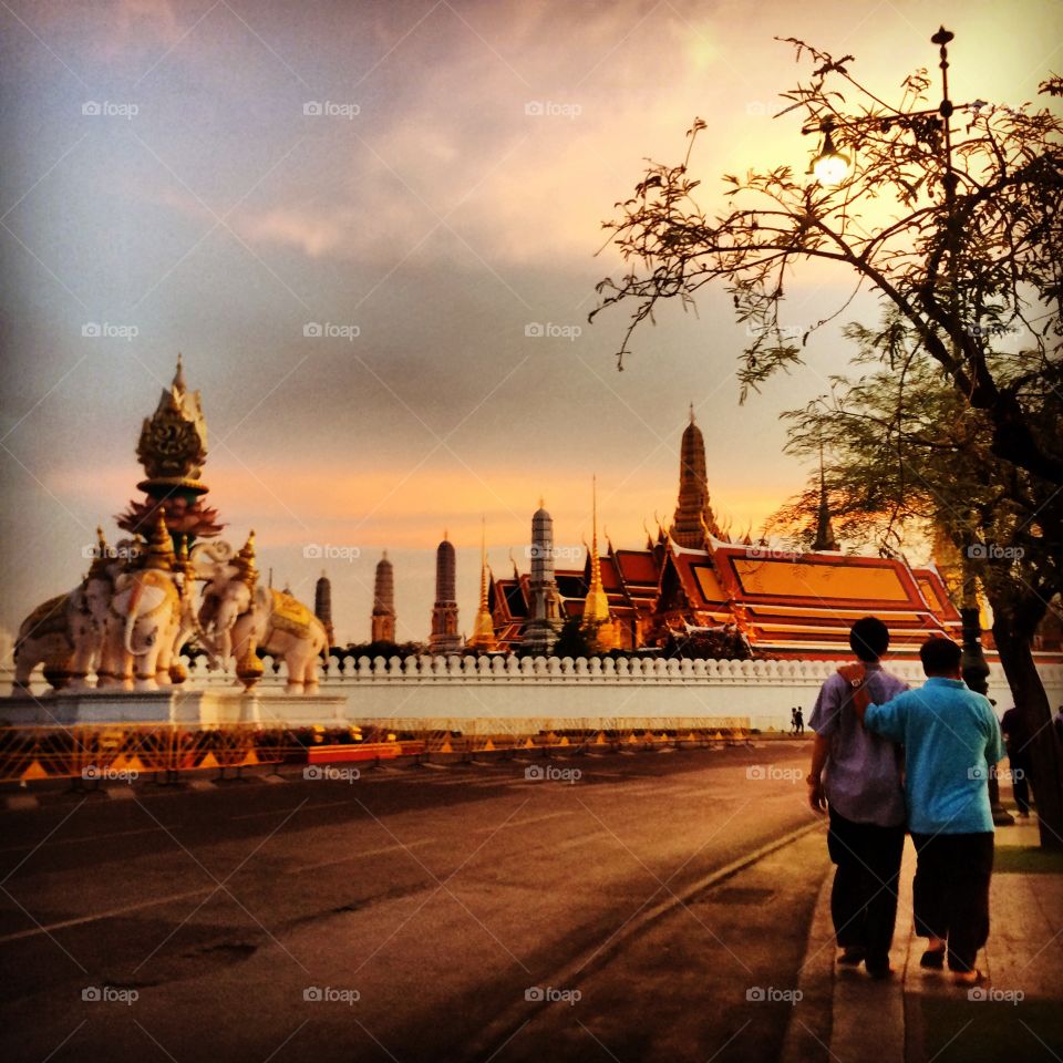 Dad n son. My dad and my brother are walking front of grand palace 