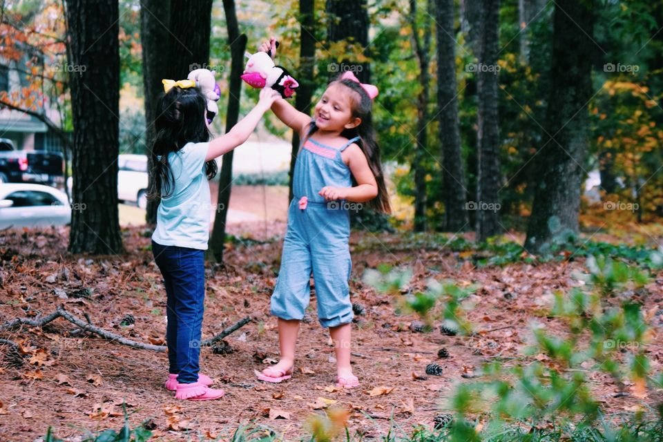 Two girls playing with toy