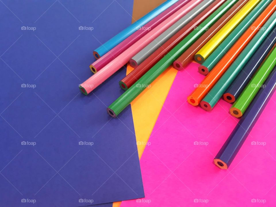 Colored pencils and leaves.