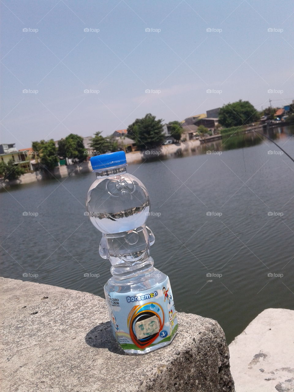 Doraemon bottle beside the lake...
