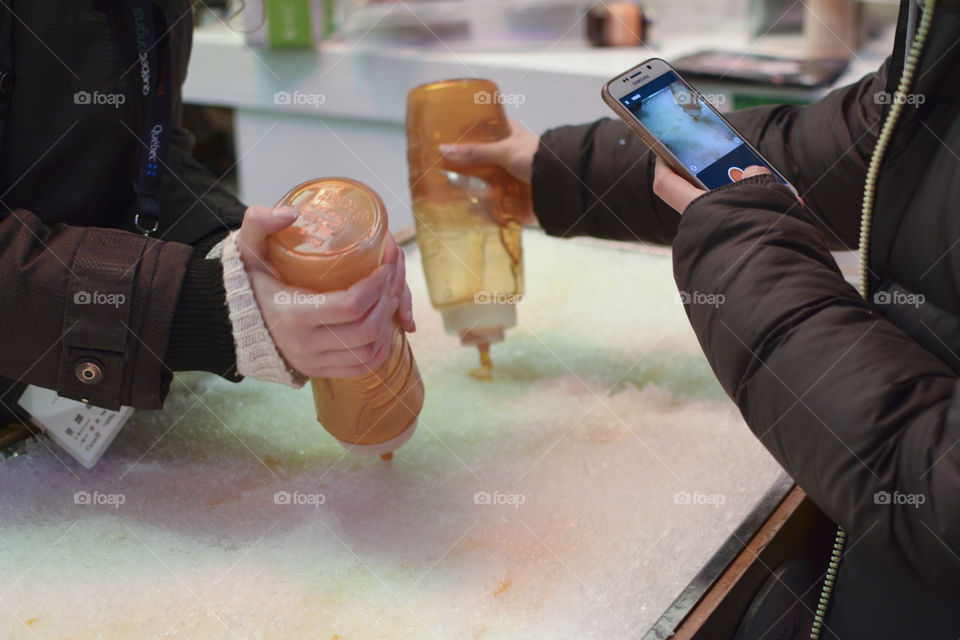 Tire Sur La Neige - making a Canadian specialty in Montreal - Frozen maple syrup on a stick