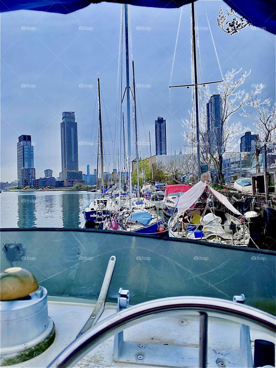 The picturesque harbor motif at Newtown Creek in LIC, Queens, NY has provided much inspiration for creativity. This photo was taken from the above „fly bridge“ sitting in front of the steering wheel overlooking the creek. 2022. Hypnotic Productions