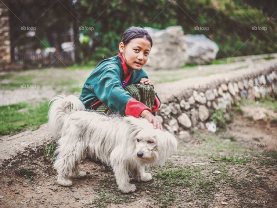 cutest puppy, pet of this girl, somewhere in bhutan