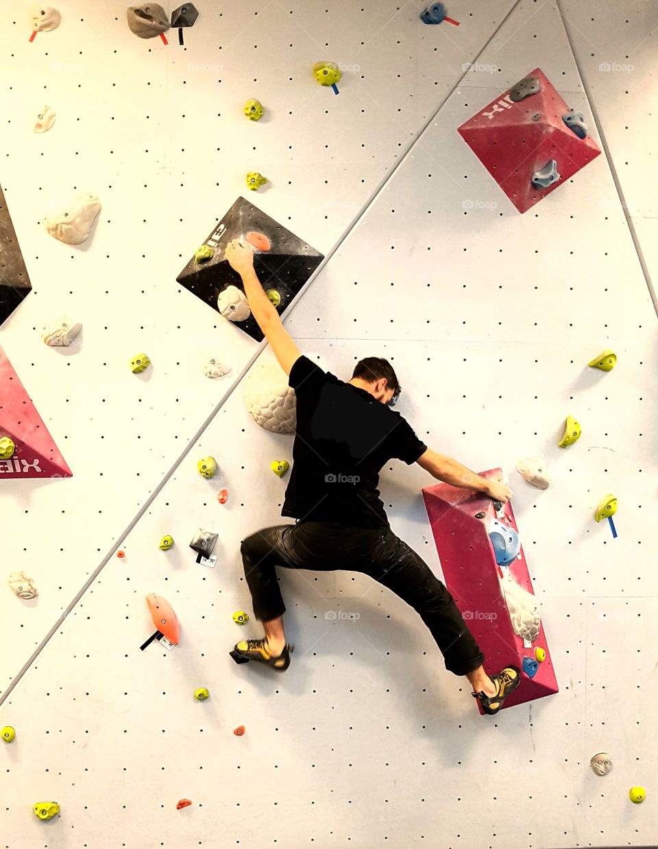 Man on climbing wall