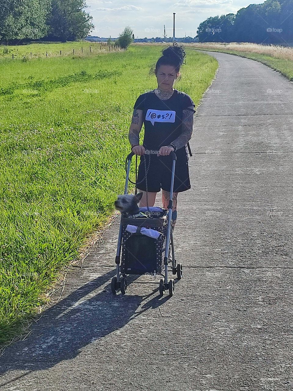 My wife and our dog on a walk