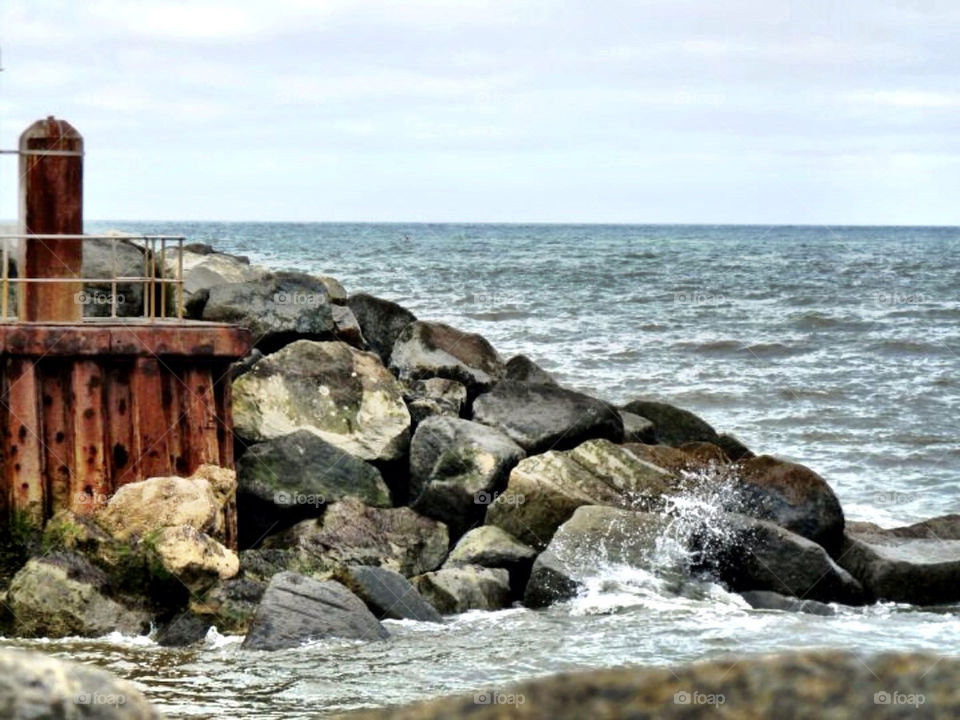 ocean rocks waves rust by llotter