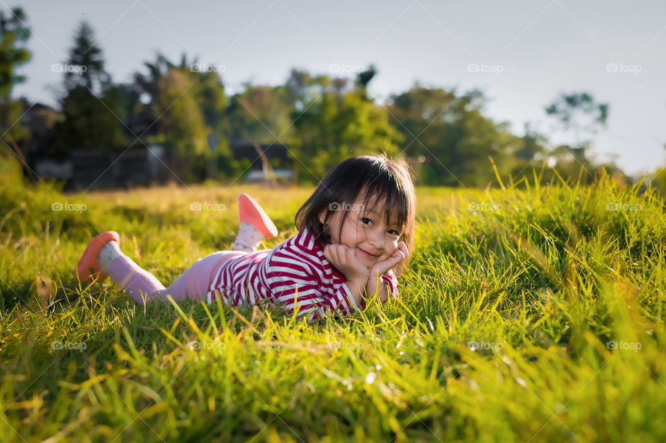 A cute little girl posing for the camera