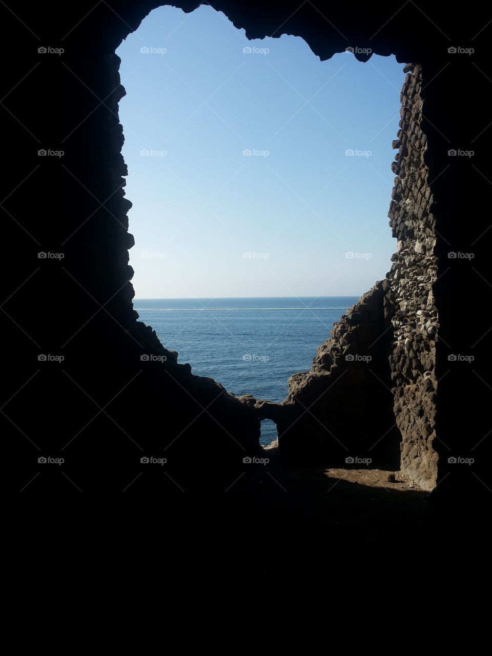 A window in the rocks to the sea