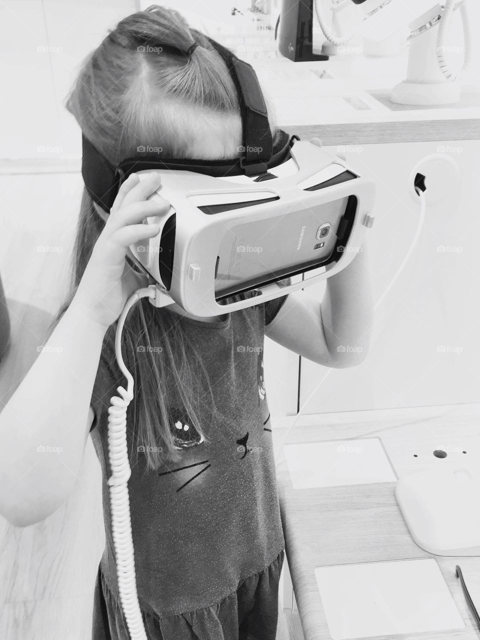 Little girl trying VR glasses