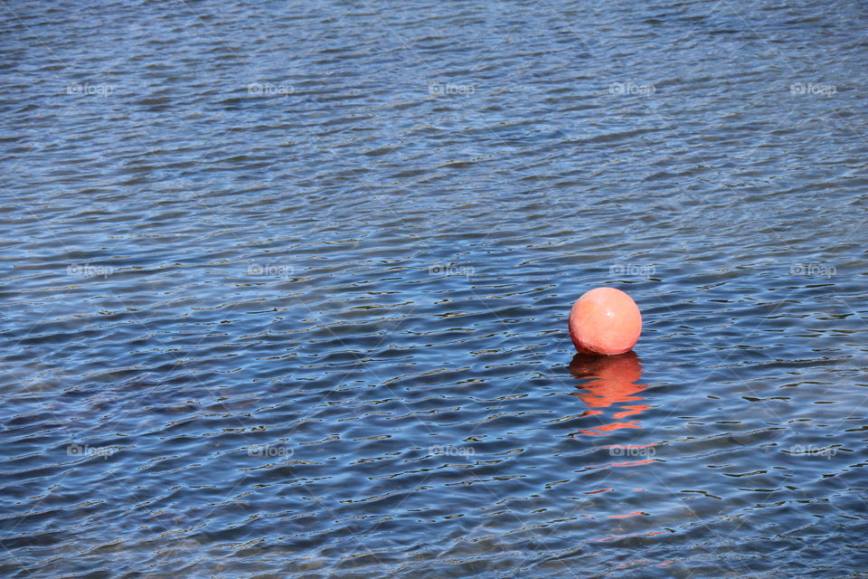 Orange ball floating on the surface