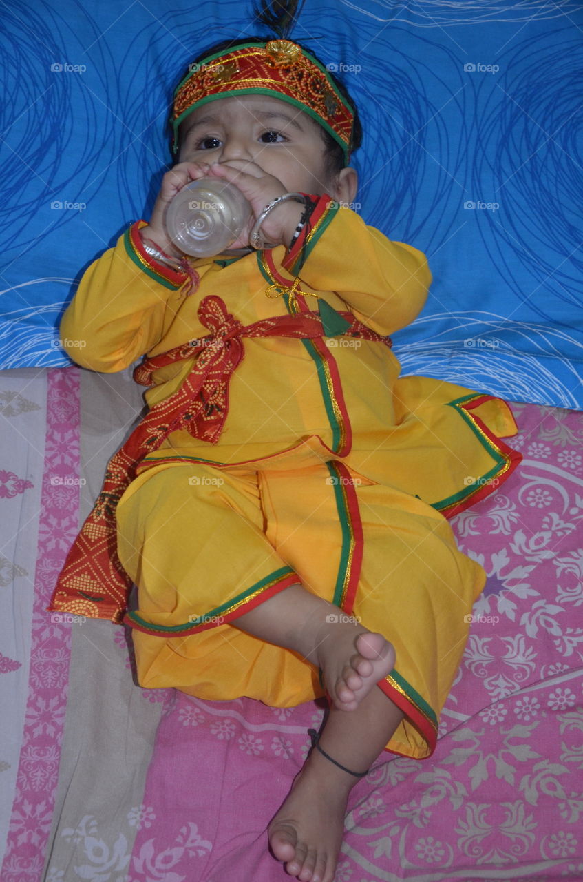 baby
boy
lord krishna wear
festival
yellow red combination
cut
drinking milk
