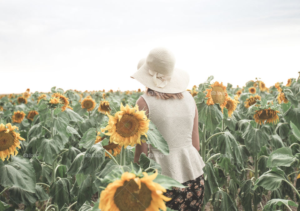 Enjoying summer in a sunflower field 