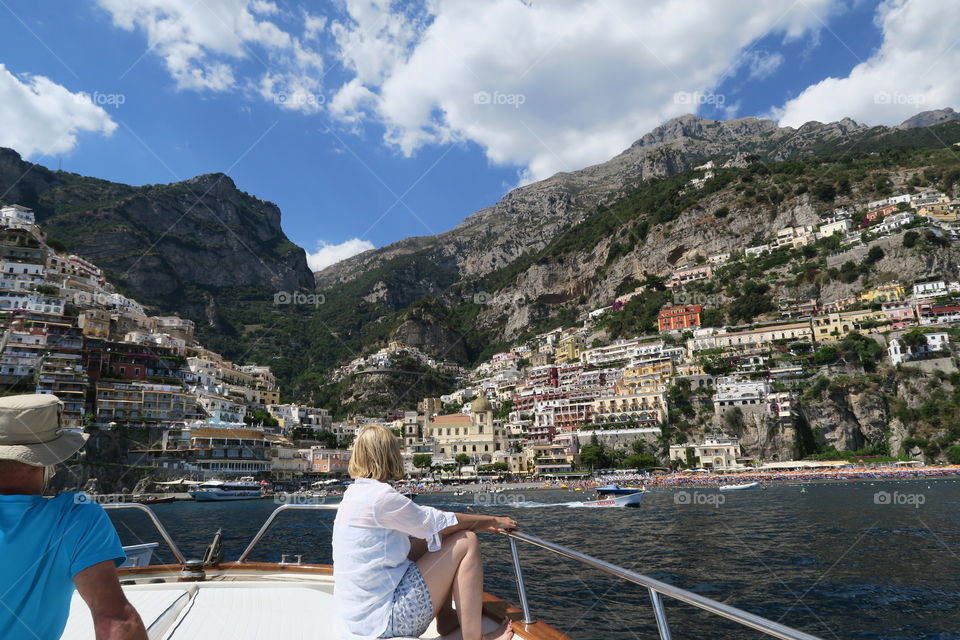 View of Amalfi, italy on coast of Mediterranean Sea. Relaxing on boat.