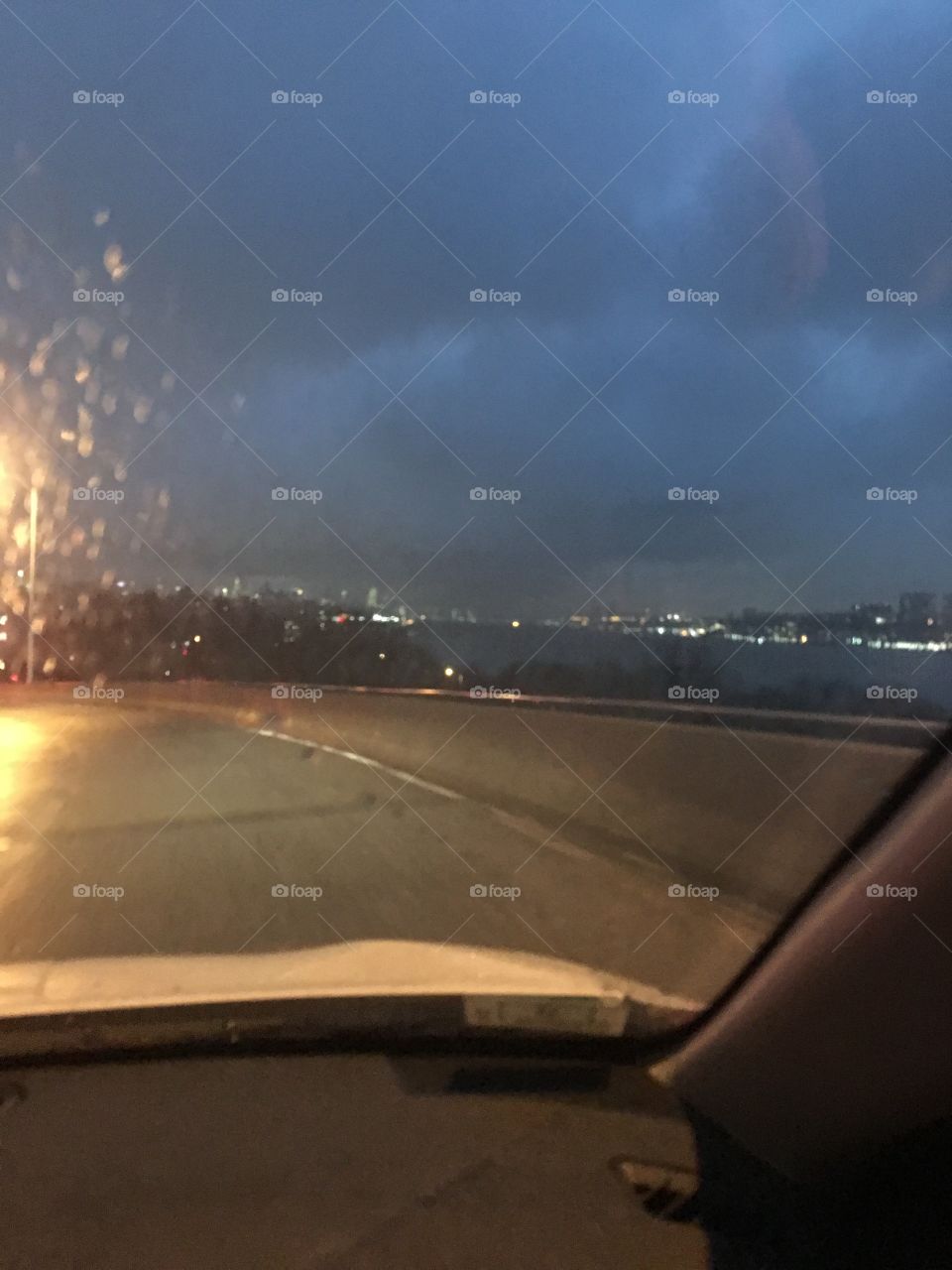 City from car on rainy night
