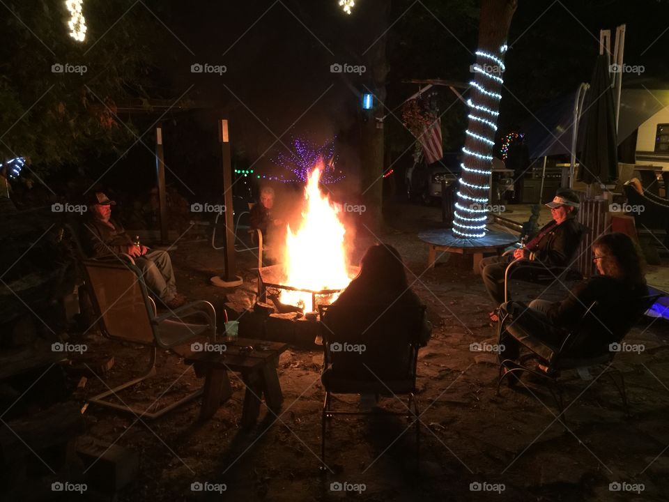 Sitting around the campfire . The end of camping season 