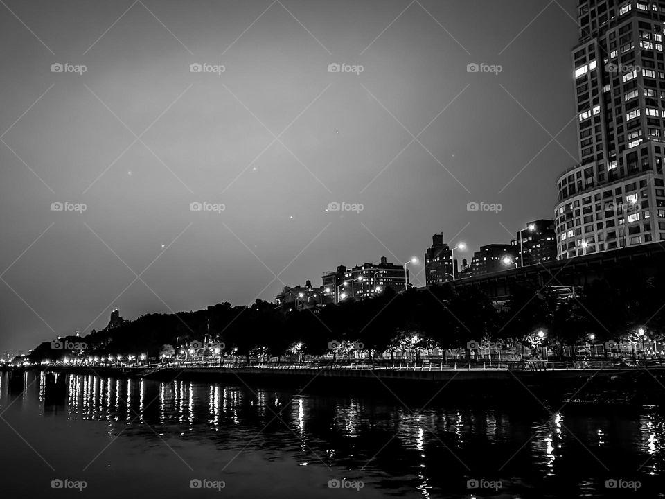 The buildings and the lights and its reflections in black and white 