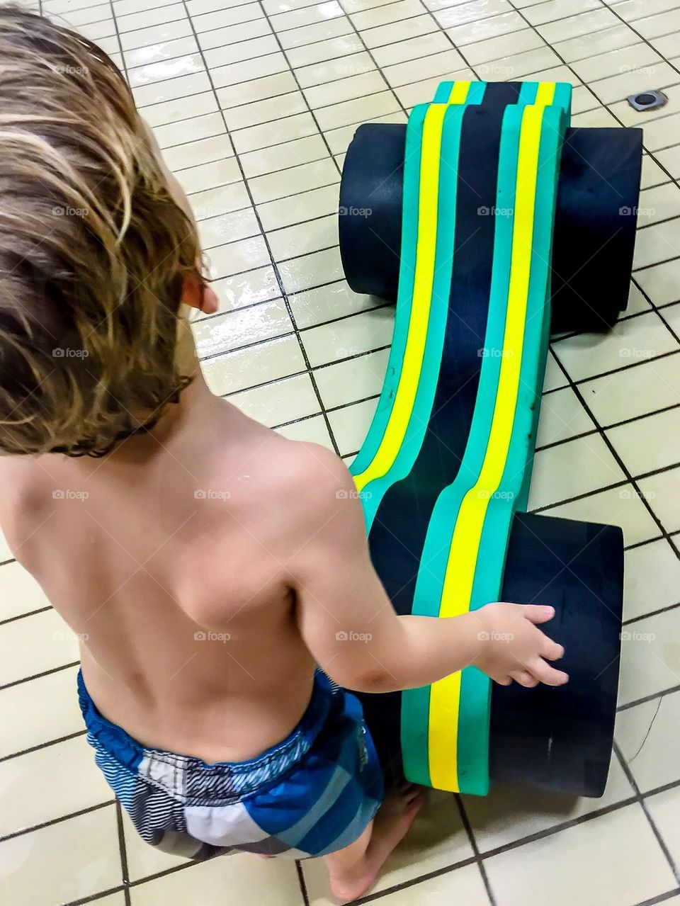 Child playing with a watertoy