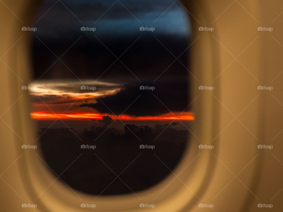 Scenic view of sunset through airplane window