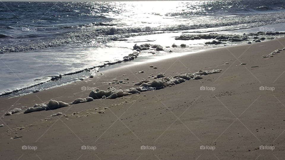 ocean foam along the shore.