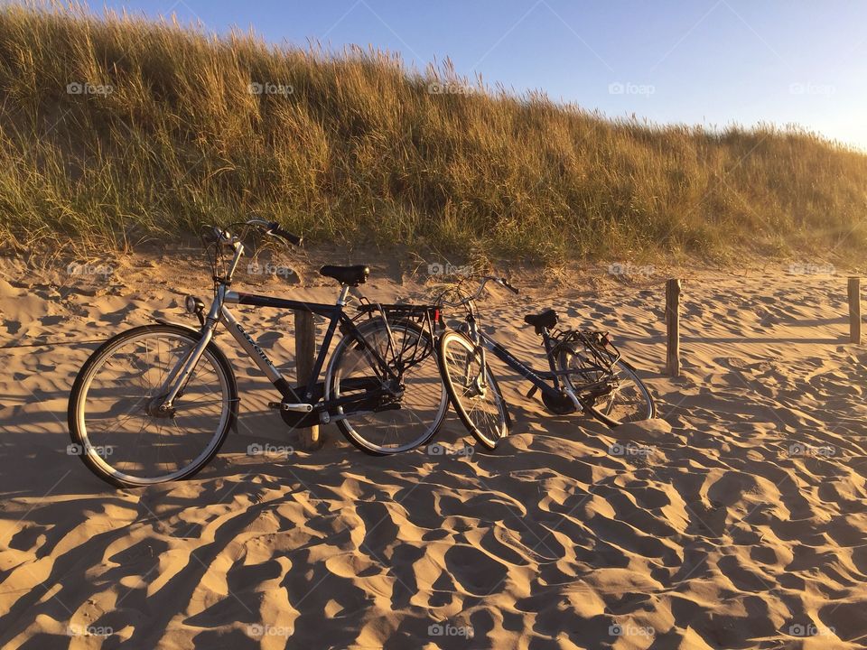 Bikes on the beach at sunset