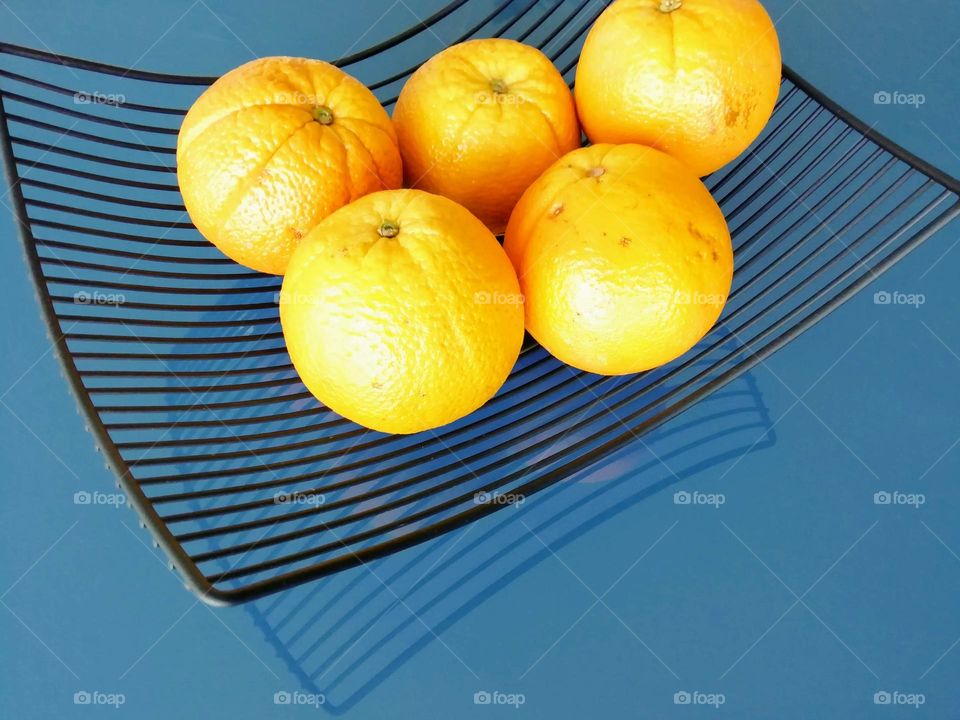 Oranges on a blue table