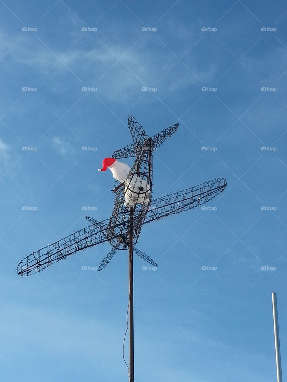 snowman flying a plane