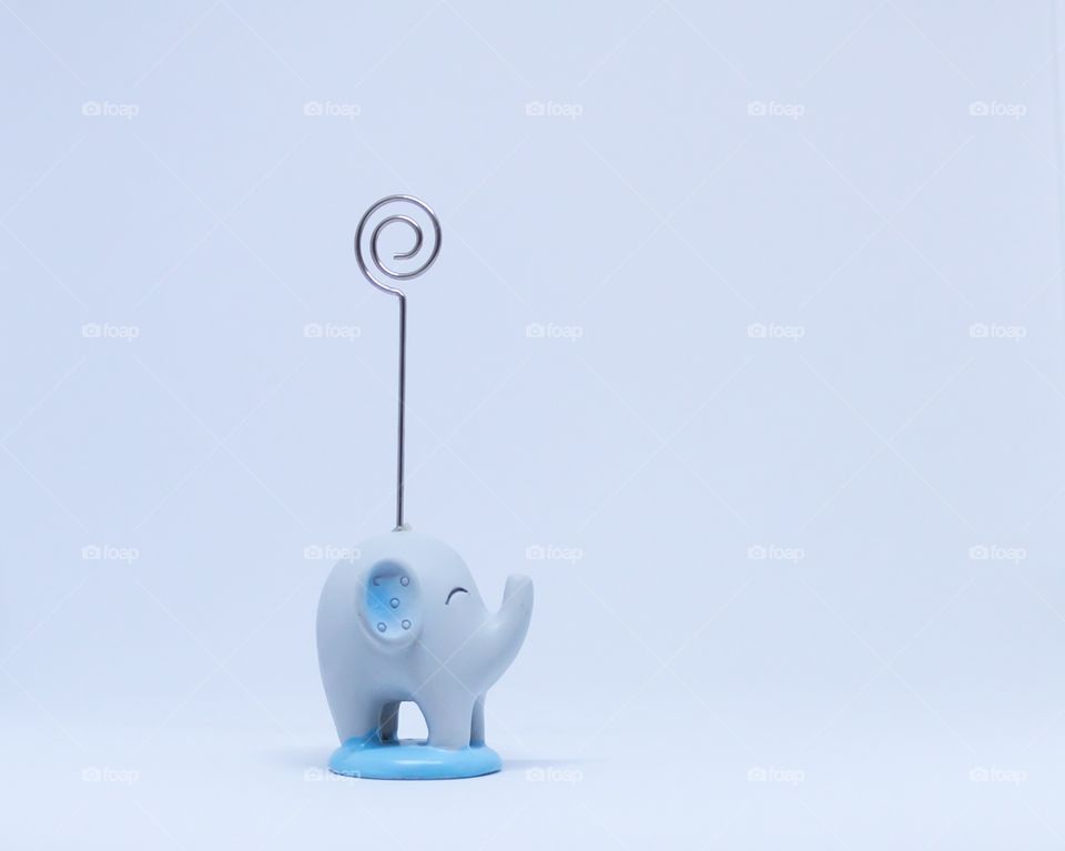 Little blue elephant on white background 