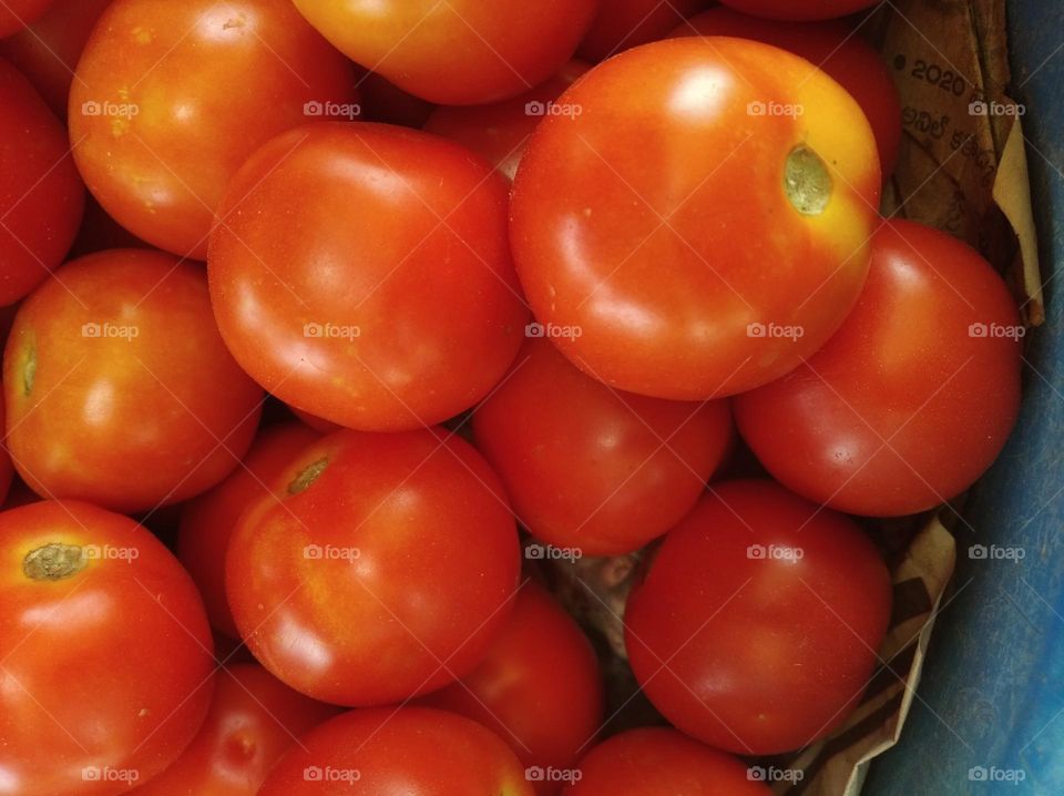 tomato Red slightly yellowish, round in shape, vegitable mostly use for salad and soup