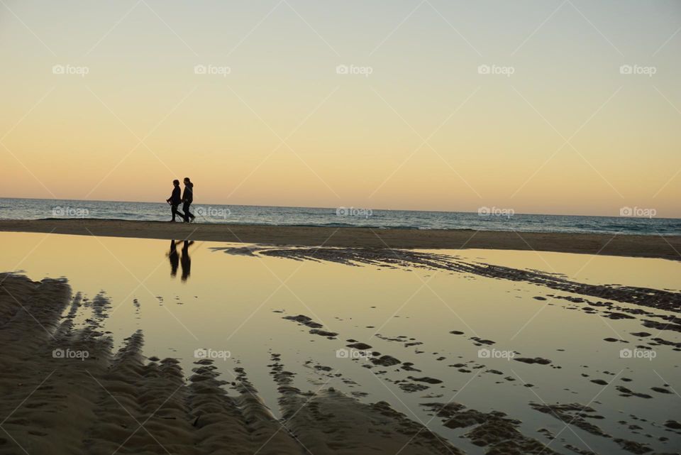 Sunset#sea#reflect#sand#human#sky