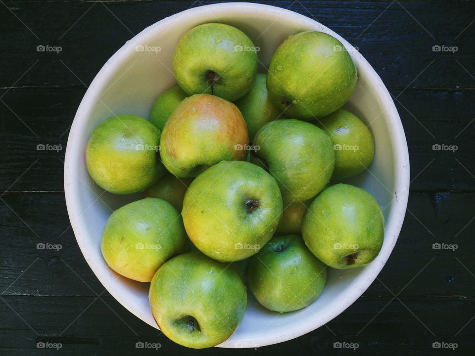 drops of water on green apple varieties of simirenko