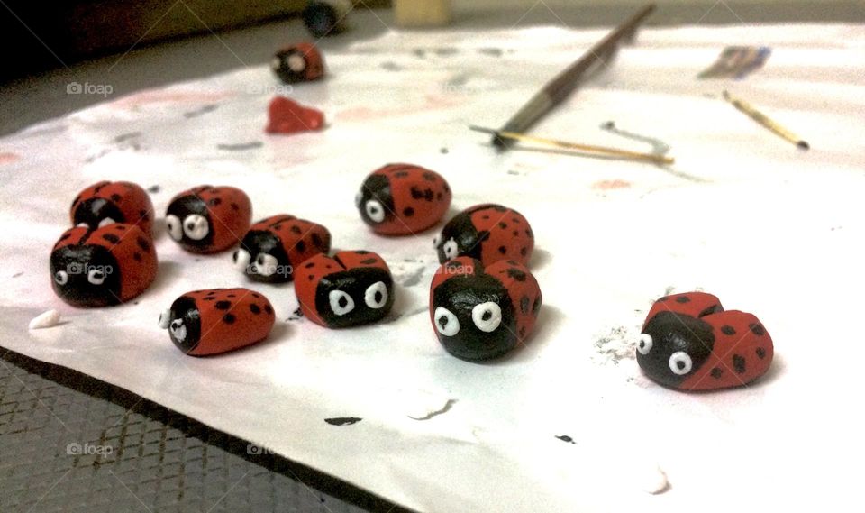 Creating ladybugs for a cake. Baking and sculpting for a cake. 