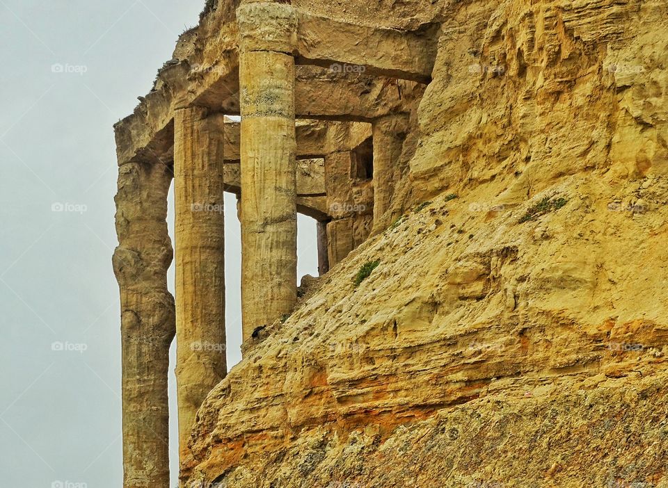 Crumbling Greek Columns. Decaying Greek Columns Of Ancient Ruin

