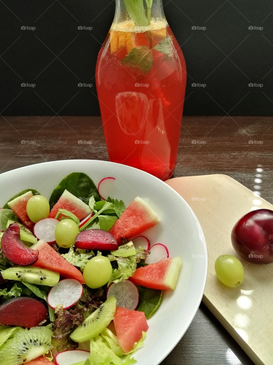 Close-up of salad and juice on table