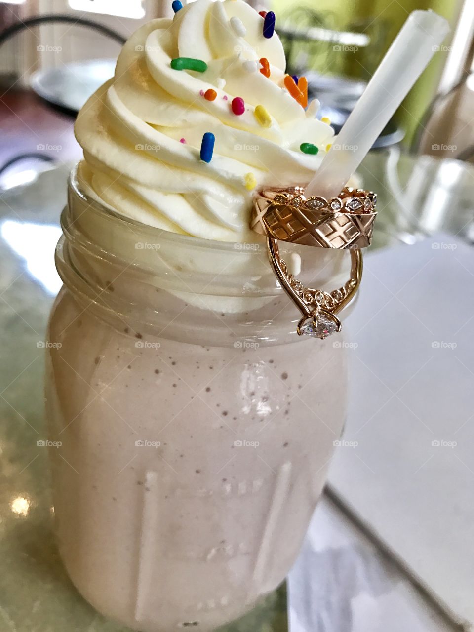 Matching rings and band on milkshake
