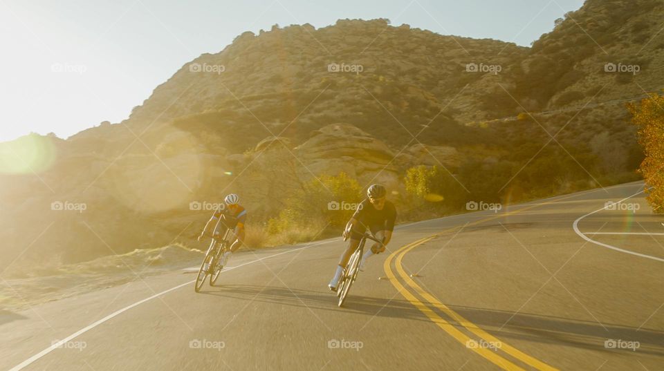 Two Friends Competing To Win Bicycle Race