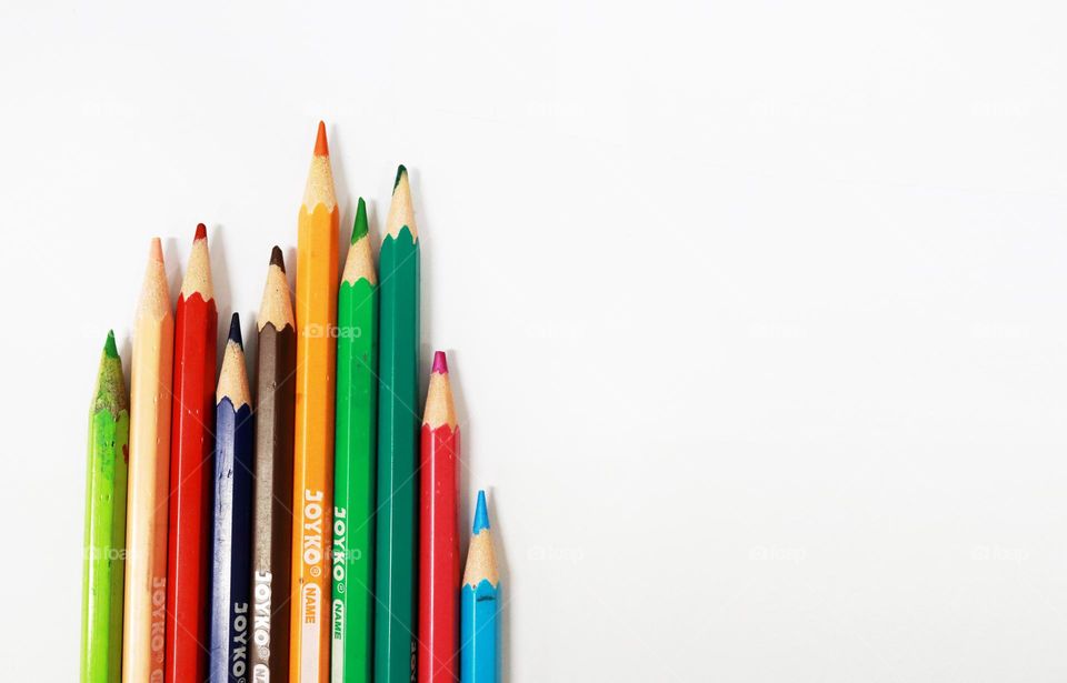colored pencils in white background