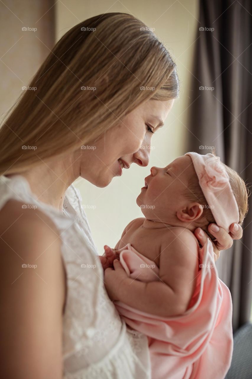 Mother with newborn daughter 