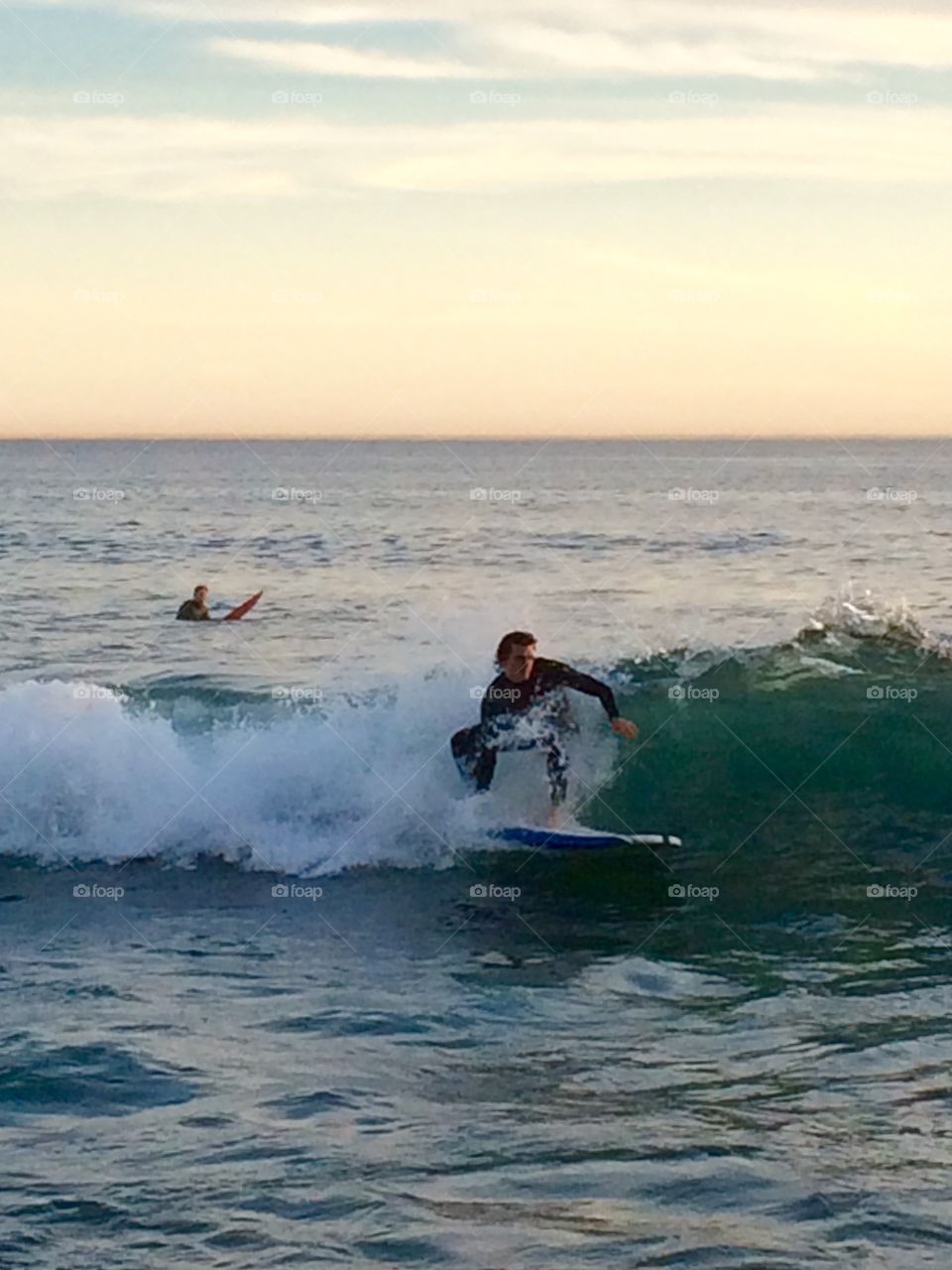 Surfing at Sunset. Surfing at Sunset