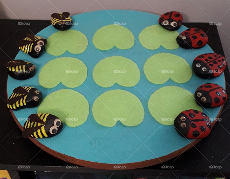 Tic Tac Toe home made; rixks for the lady bugs and the bees