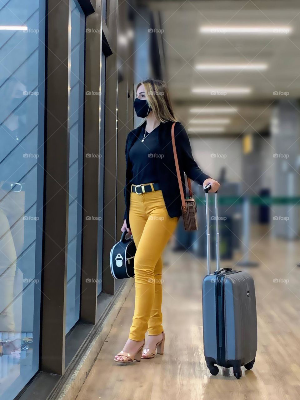 Woman looking out of airport window