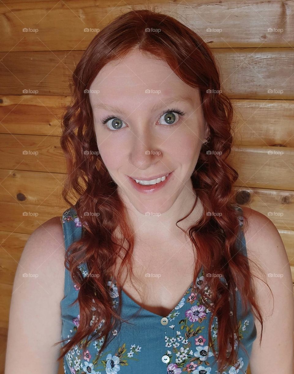 Portrait of a Red Head with a Cedar Log Background